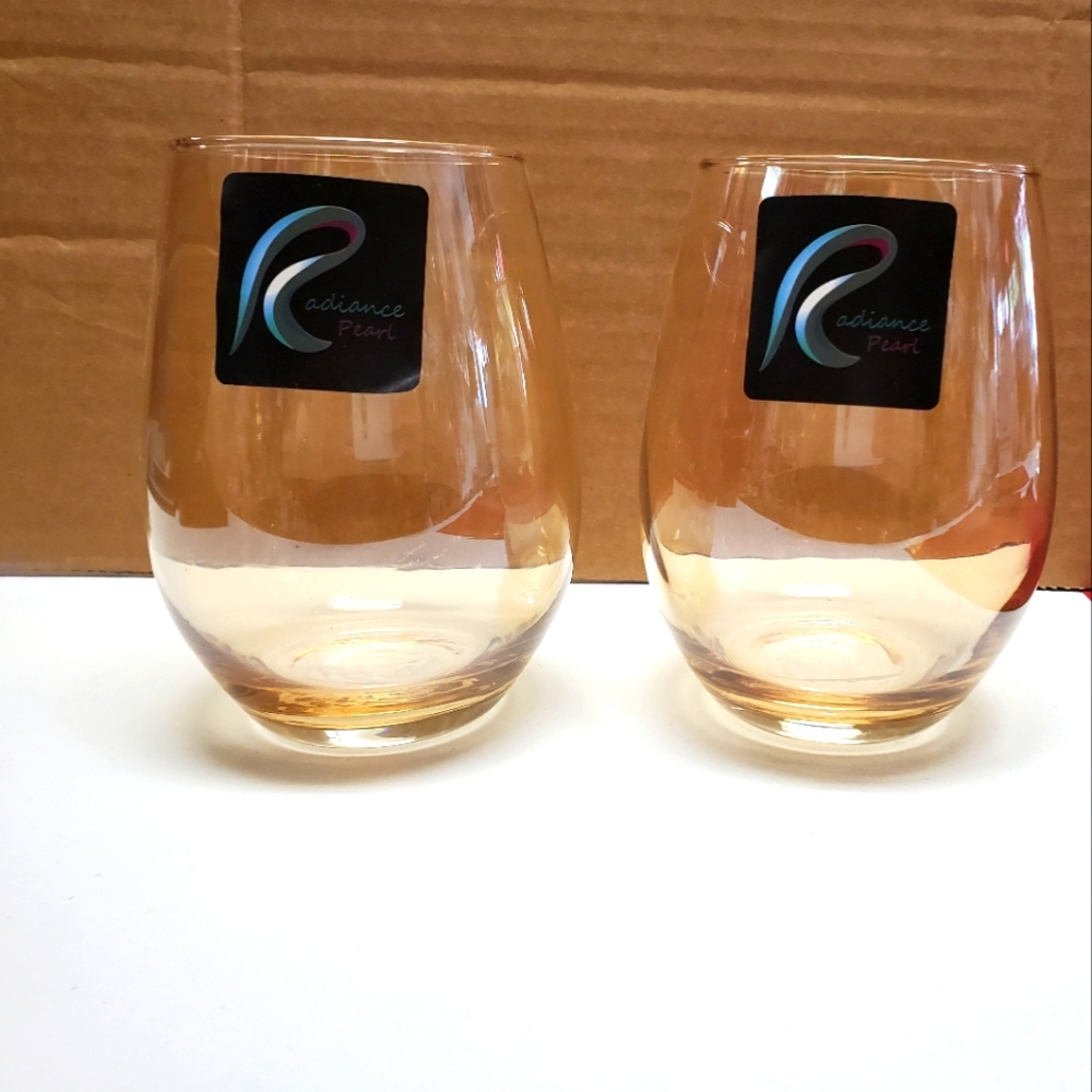 Set of 4 elegant golden drink glasses.